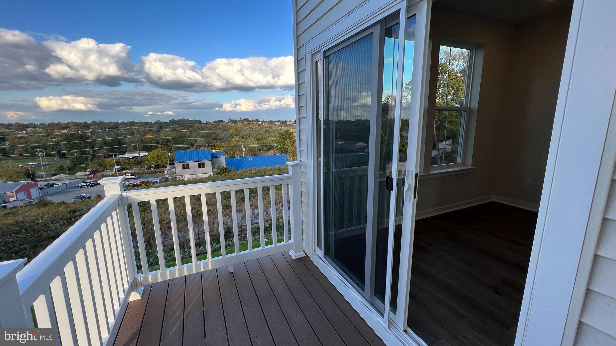 839 Pecan Road Spring City, PA 19475 - Photo 19 of 25 a view of a balcony with wooden floor and city view