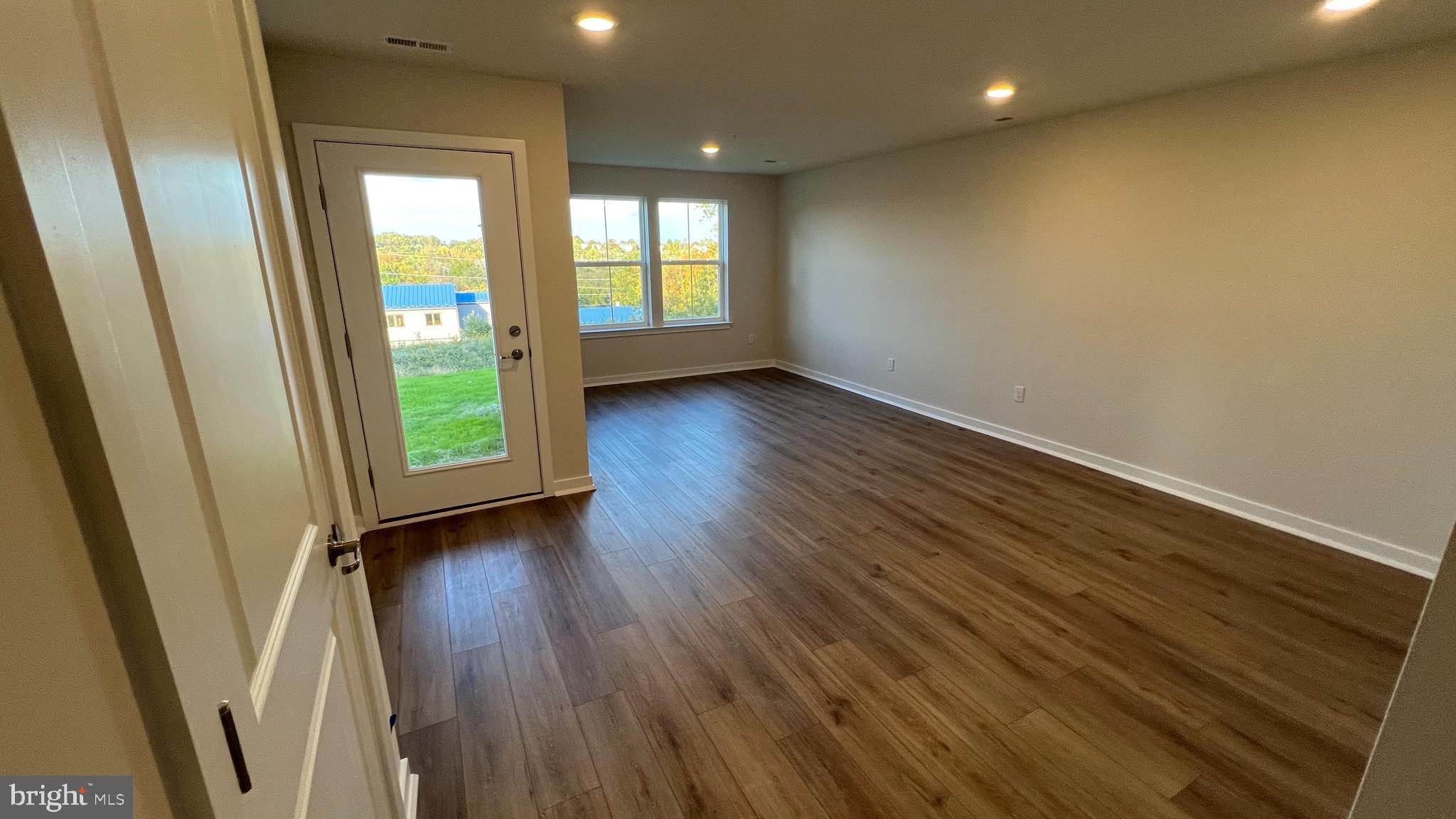 839 Pecan Road Spring City, PA 19475 - Photo 21 of 25 an empty room with wooden floor and a window