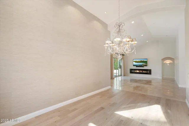 a view of a kitchen with a refrigerator and a window