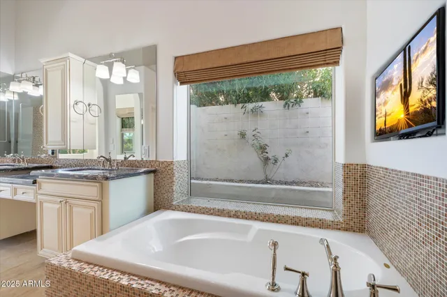 a bathroom with a bathtub and shower