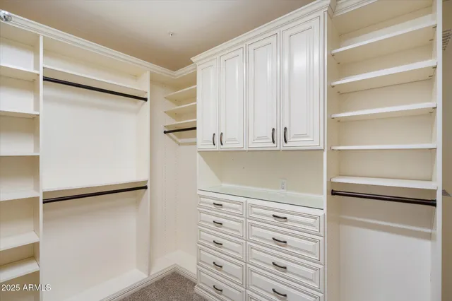 a bathroom with a granite countertop sink mirror and a bathtub