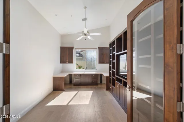 a bathroom with a granite countertop sink a toilet and a mirror