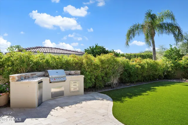 a view of a house with backyard and porch