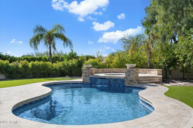 a view of a swimming pool and a garden