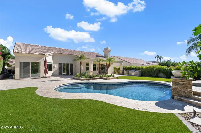 a view of a swimming pool with a sitting space