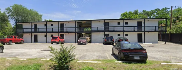 a view of a cars park in front of house