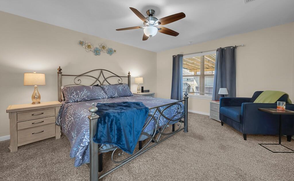 4101 King Ranch Road Waco, TX 76705 - Photo 16 of 32 a bedroom with a bed and furniture