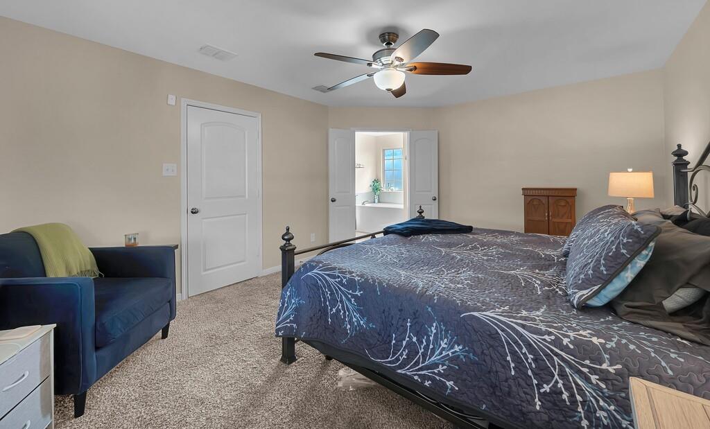 4101 King Ranch Road Waco, TX 76705 - Photo 17 of 32 a bedroom with a bed couch and window