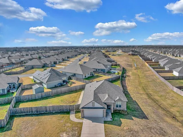an aerial view of a house with a ocean view