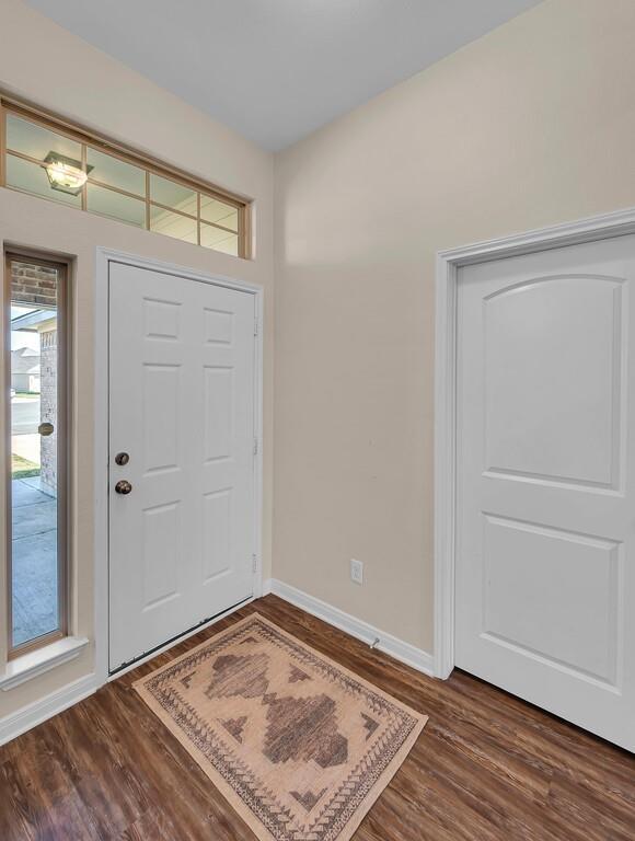 4101 King Ranch Road Waco, TX 76705 - Photo 4 of 32 wooden floor in an empty room
