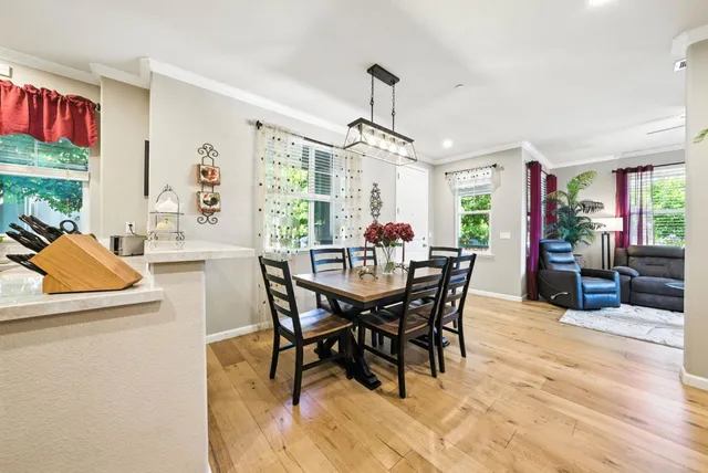 a view of a dining room with furniture window and outside view