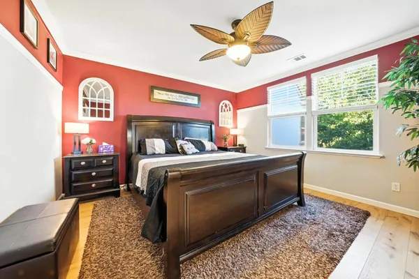 a bed room with a bed and a window