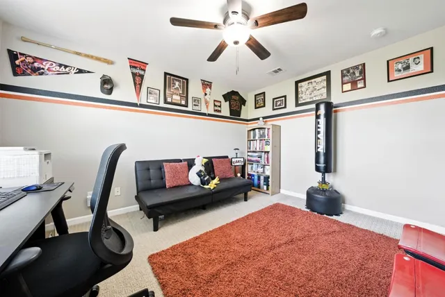 a living room with furniture and a rug