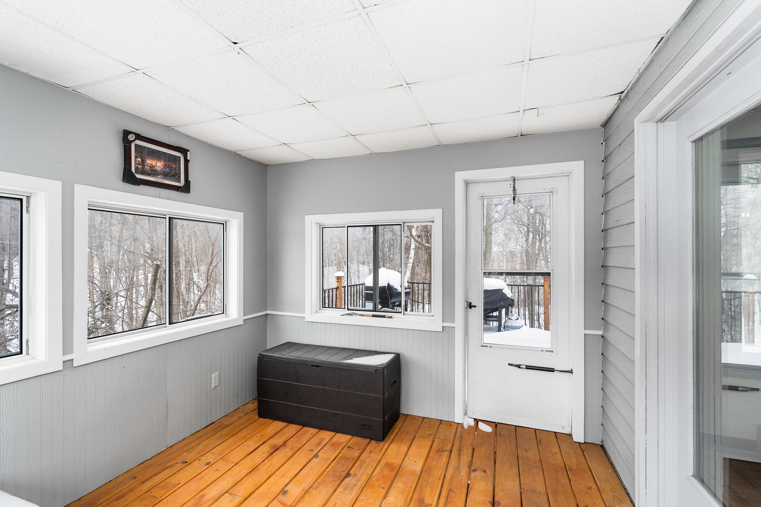 5105 Sheridan Road Hermantown, MN 55810 - Photo 10 of 39 Sun porch with door to the large deck