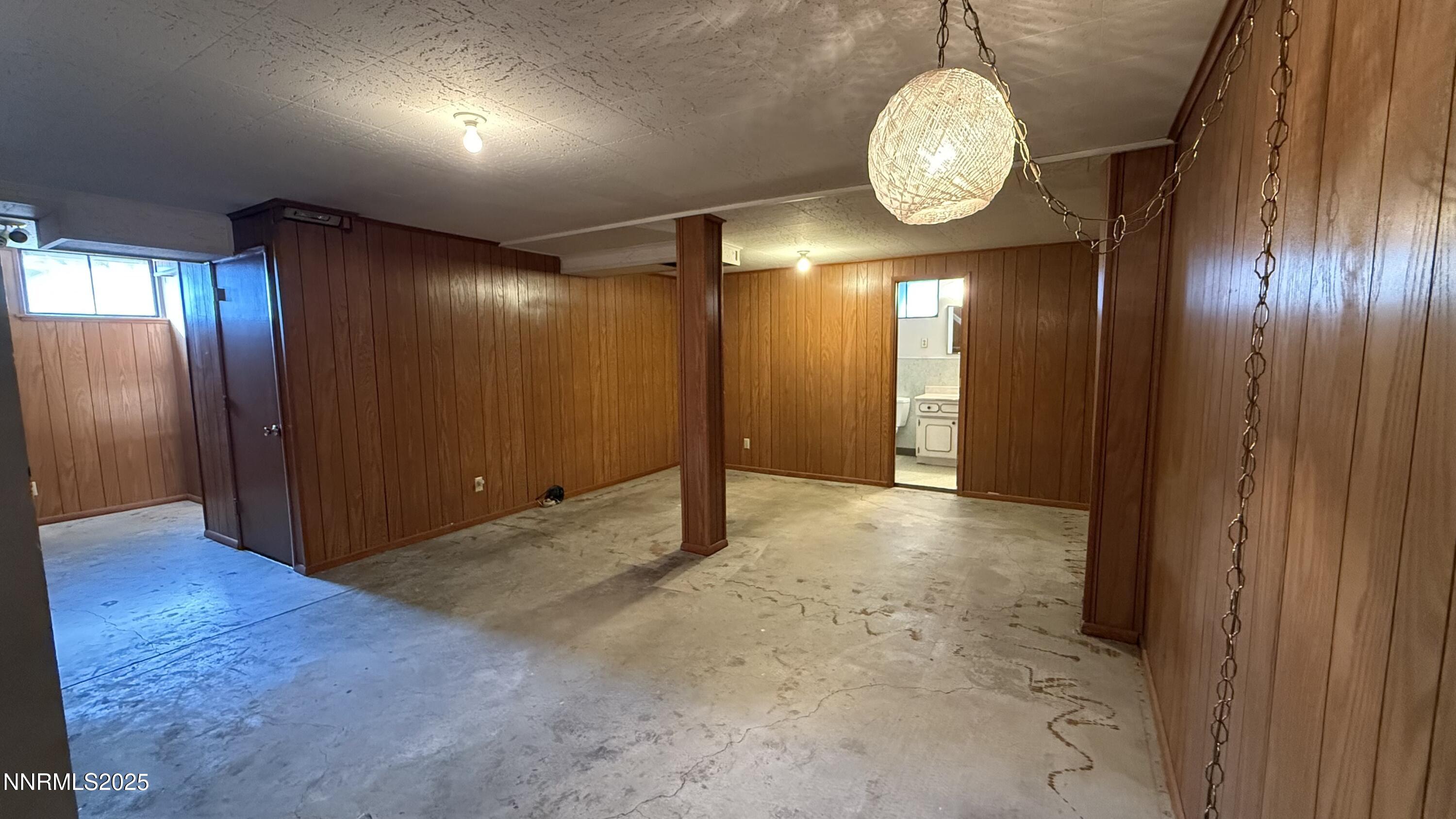 1455 Wesley Drive Reno, NV 89503 - Photo 18 of 27 an empty room with wooden floor and windows