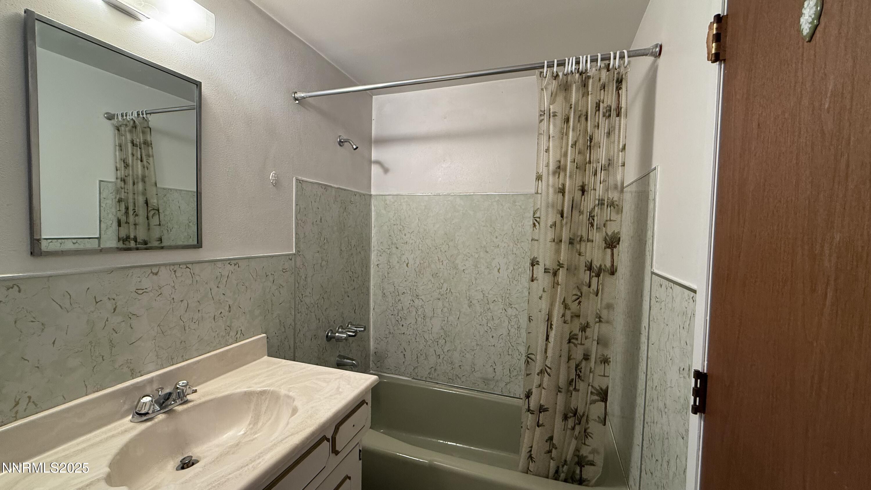 1455 Wesley Drive Reno, NV 89503 - Photo 20 of 27 a bathroom with a sink and a mirror