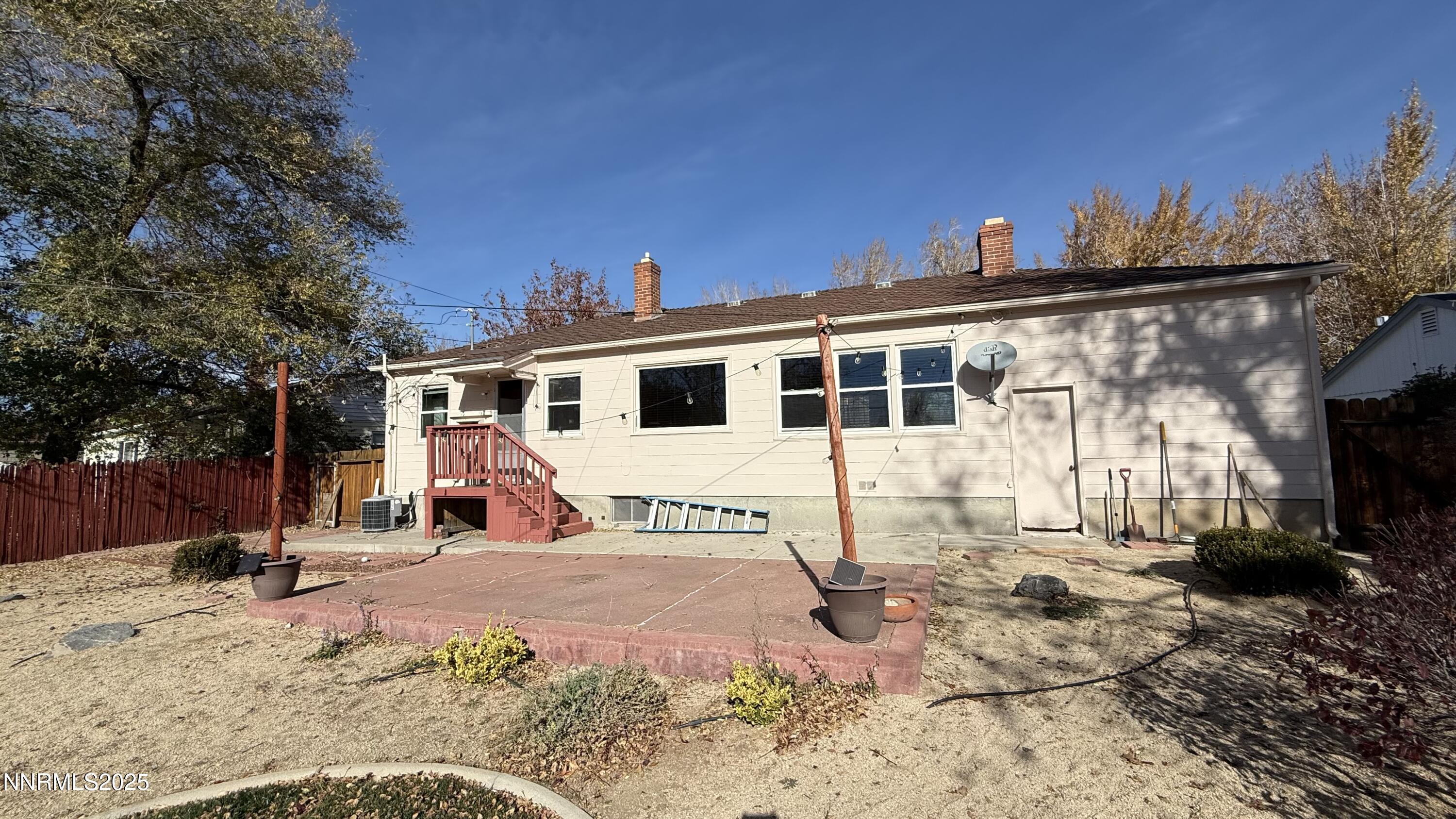 1455 Wesley Drive Reno, NV 89503 - Photo 26 of 27 a view of a house with a patio covered with snow