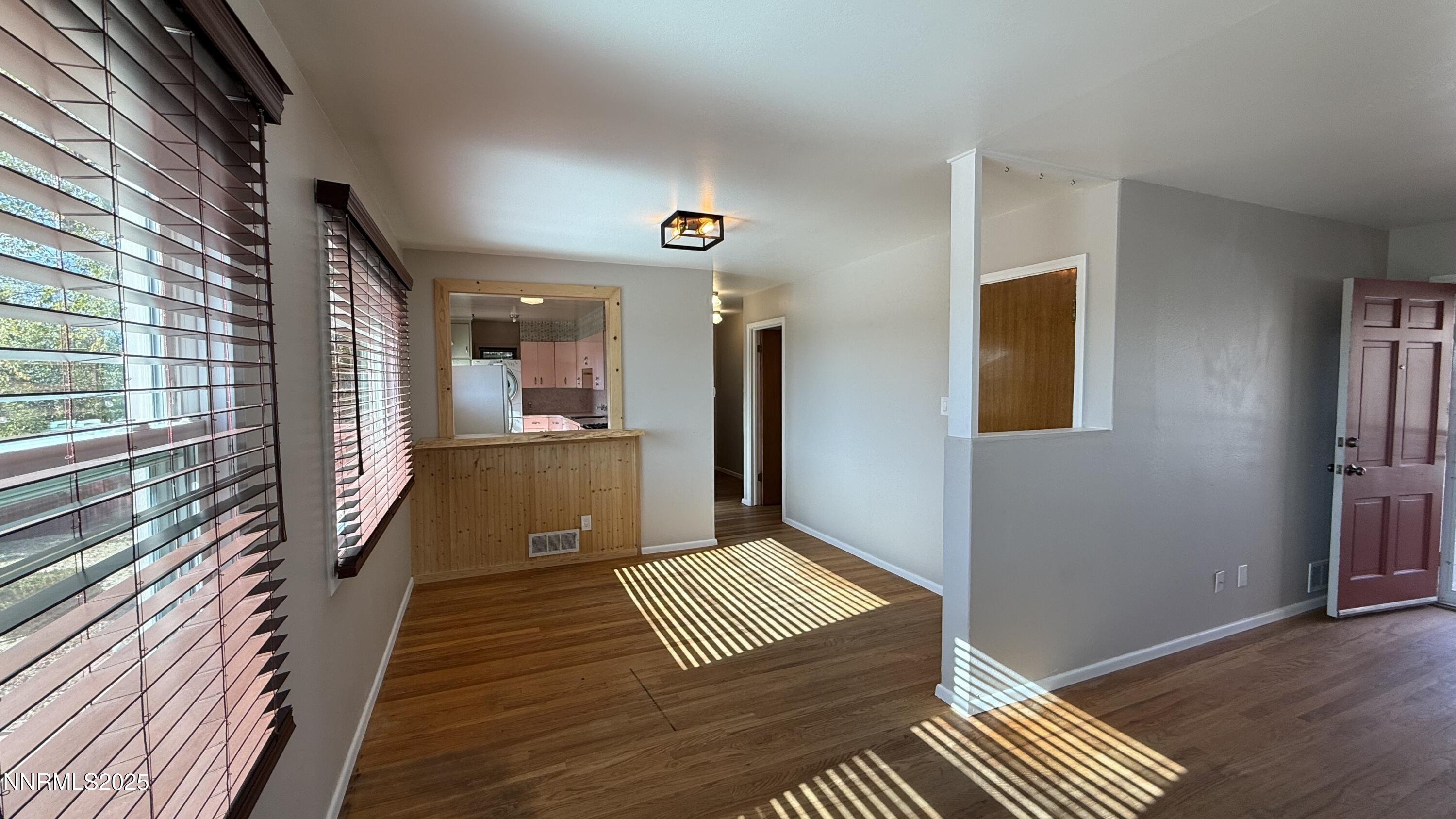 1455 Wesley Drive Reno, NV 89503 - Photo 6 of 27 a view of a hallway with wooden floor