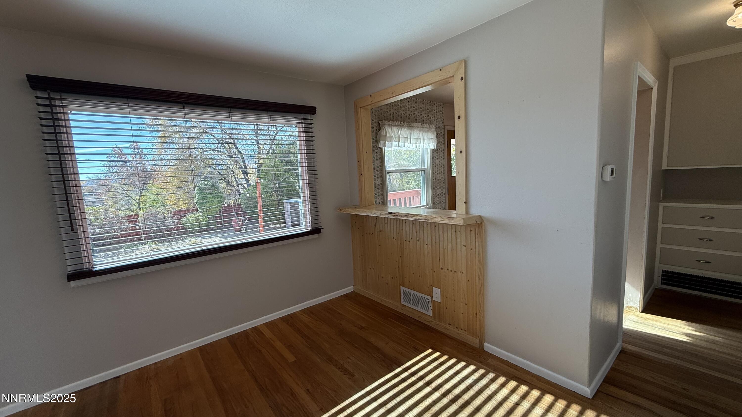 1455 Wesley Drive Reno, NV 89503 - Photo 7 of 27 a view of a room with wooden floor and windows