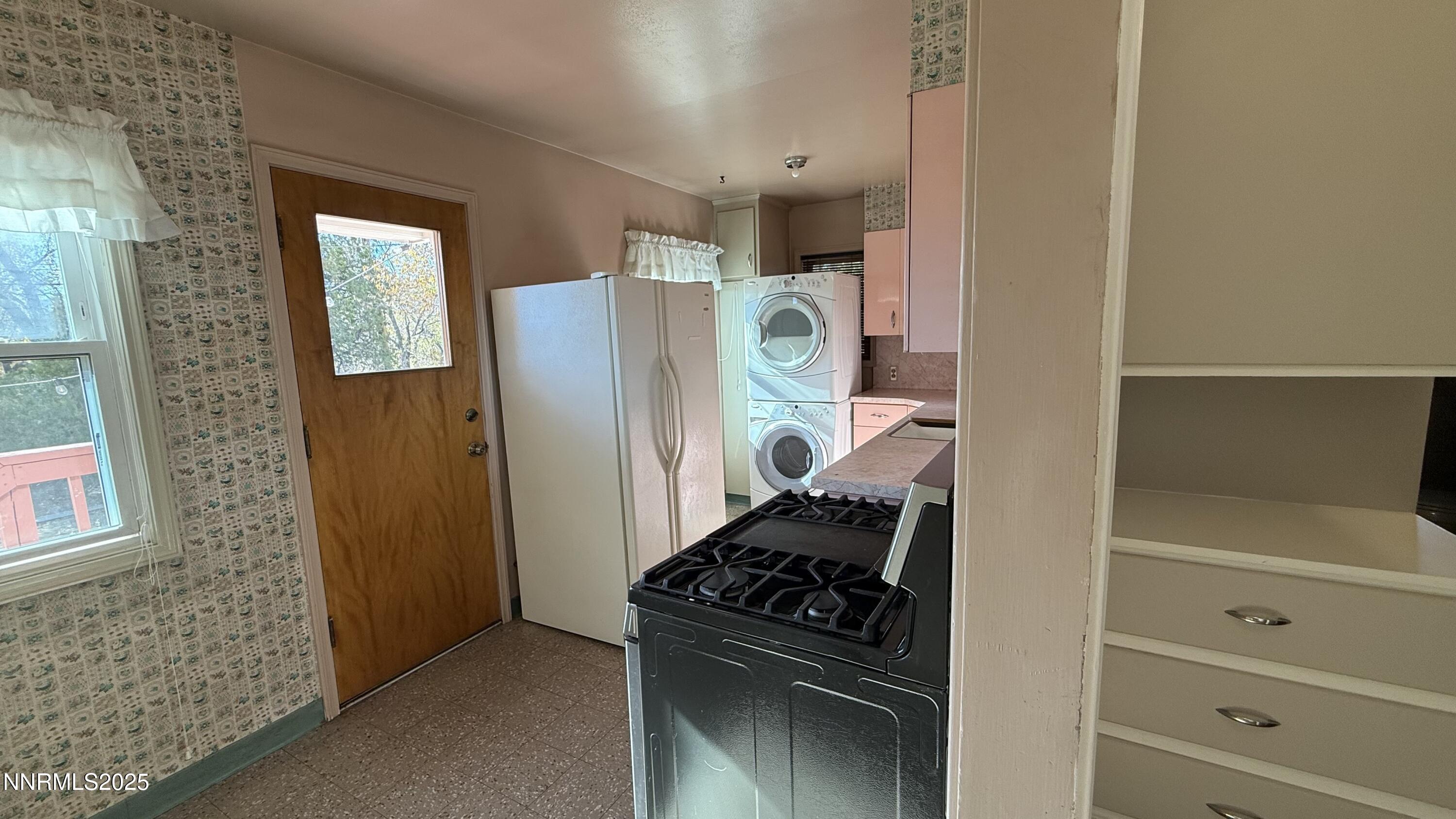 1455 Wesley Drive Reno, NV 89503 - Photo 9 of 27 a kitchen with a refrigerator and a stove
