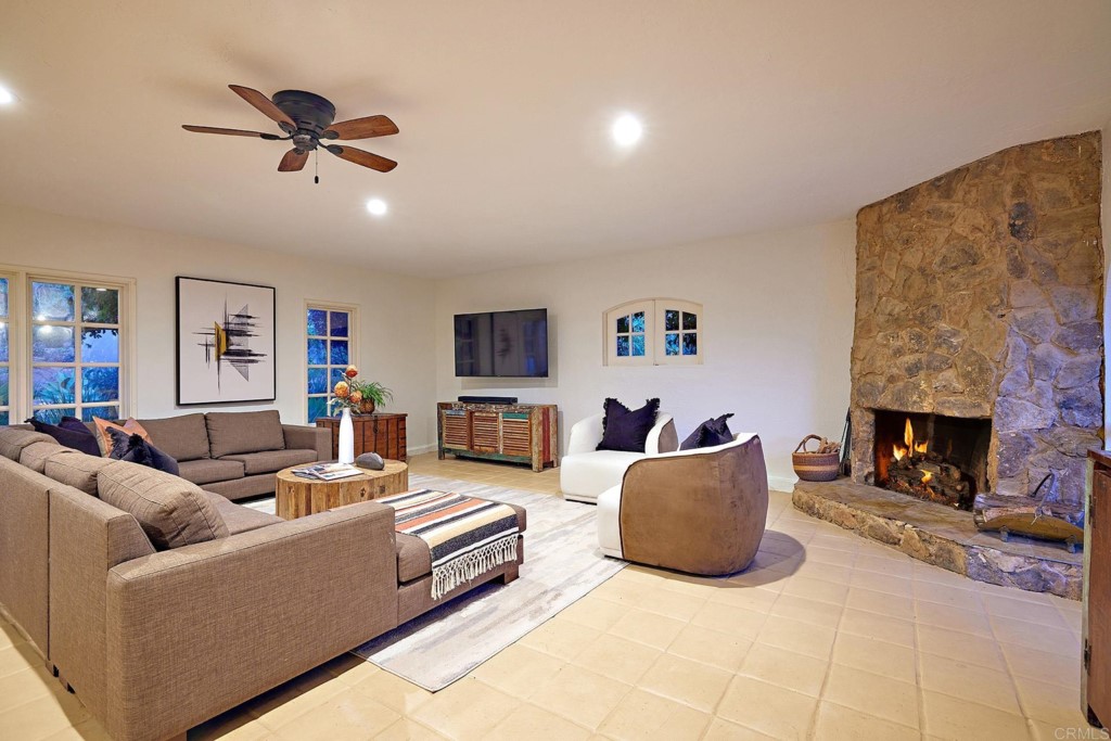 3182 Lone Jack Road Encinitas, CA 92024 - Photo 11 of 37 a living room with furniture and a fireplace