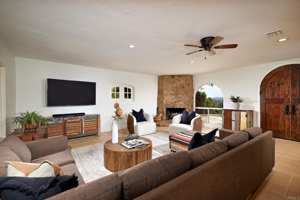 3182 Lone Jack Road Encinitas, CA 92024 - Photo 12 of 37 a living room with furniture and a flat screen tv