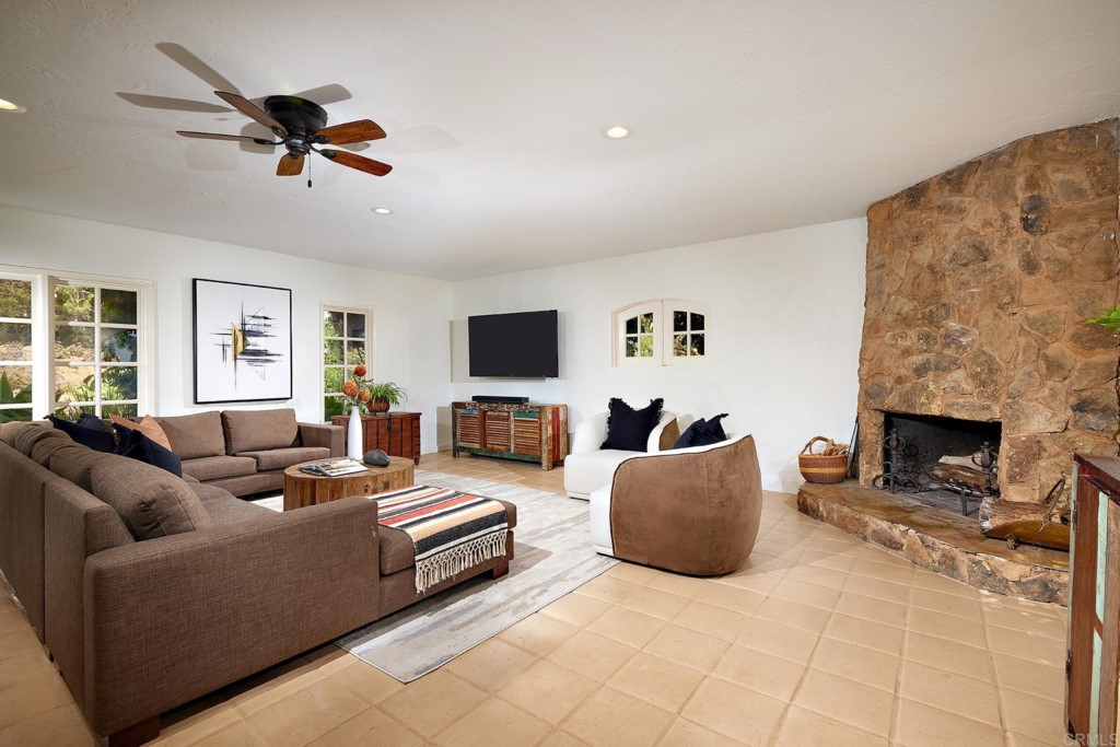 3182 Lone Jack Road Encinitas, CA 92024 - Photo 13 of 37 a living room with furniture and a fireplace