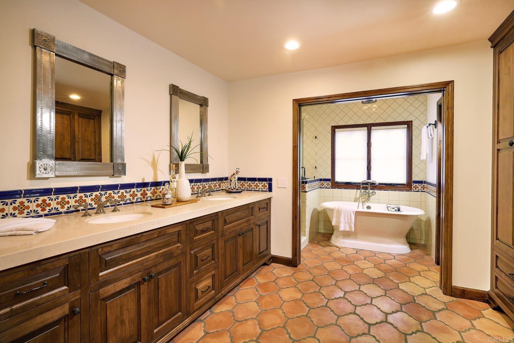 3182 Lone Jack Road Encinitas, CA 92024 - Photo 22 of 37 a bathroom with a sink vanity and mirror