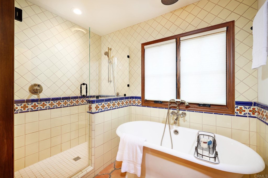 3182 Lone Jack Road Encinitas, CA 92024 - Photo 23 of 37 a bathroom with a bathtub and a shower