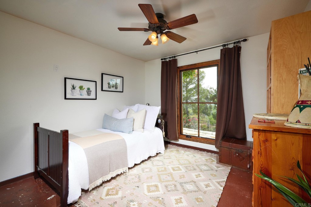 3182 Lone Jack Road Encinitas, CA 92024 - Photo 28 of 37 a bedroom with a large bed and a window
