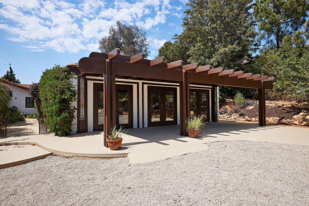 3182 Lone Jack Road Encinitas, CA 92024 - Photo 29 of 37 a front view of a house with garden and porch