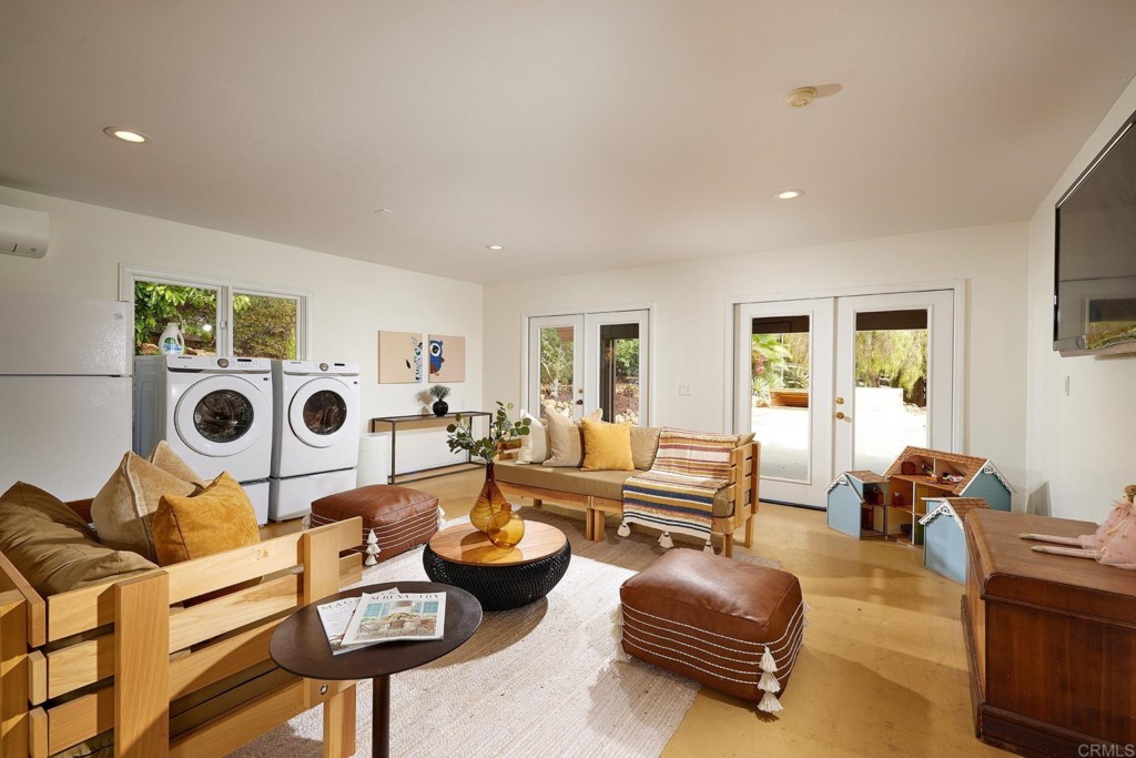 3182 Lone Jack Road Encinitas, CA 92024 - Photo 30 of 37 a living room with furniture and a table