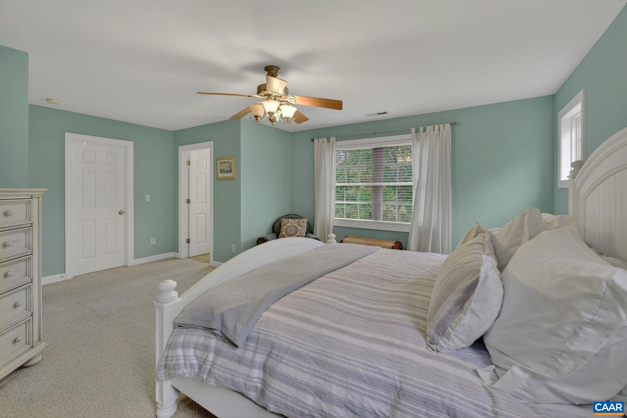 511 Taylor Ridge Way Palmyra, VA 22963 - Photo 31 of 57 a bedroom with a large bed and a window