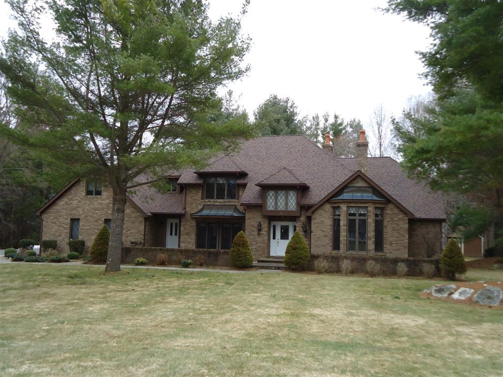 16 Prospect Hill Road Stockbridge, MA 01262 - Photo 1 of 25 a front view of a house with a garden