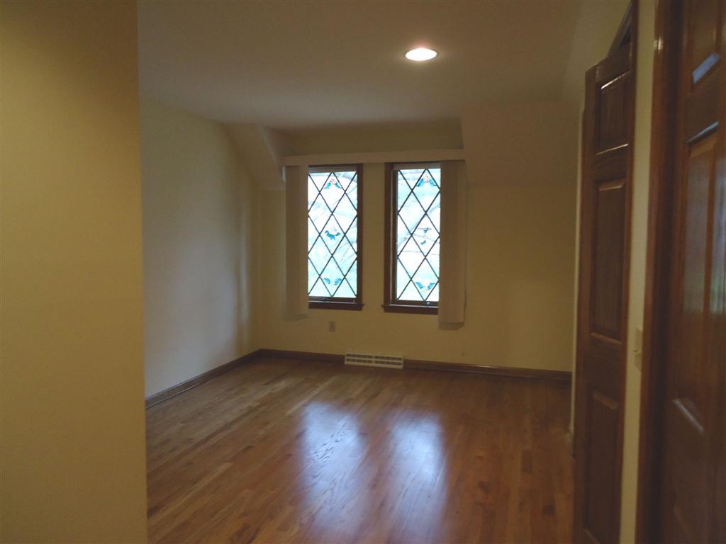 16 Prospect Hill Road Stockbridge, MA 01262 - Photo 20 of 25 an empty room with wooden floor and windows