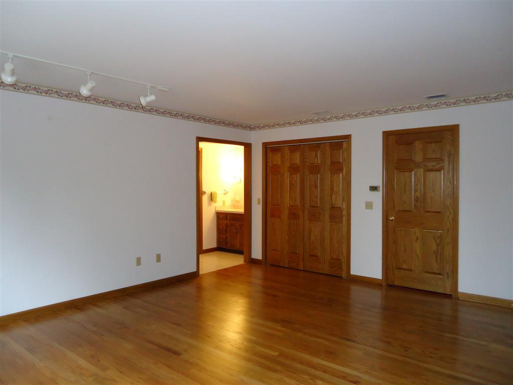 16 Prospect Hill Road Stockbridge, MA 01262 - Photo 21 of 25 an empty room with wooden floor and windows