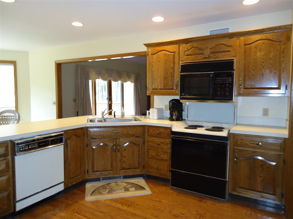16 Prospect Hill Road Stockbridge, MA 01262 - Photo 9 of 25 a kitchen with a sink stove and microwave