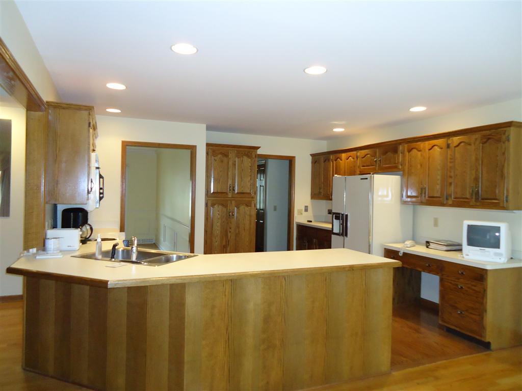 16 Prospect Hill Road Stockbridge, MA 01262 - Photo 10 of 25 a kitchen with kitchen island granite countertop a sink cabinets and stainless steel appliances