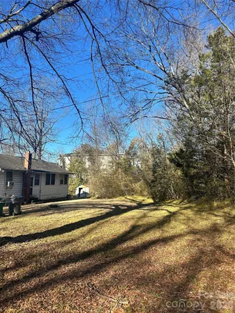 a view of a yard with tree s