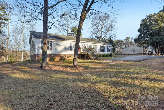 a view of road with large trees