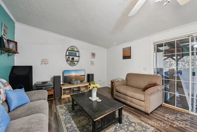 a living room with furniture and a flat screen tv