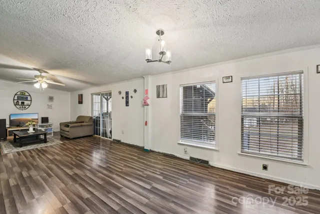 a view of a livingroom with furniture and windows