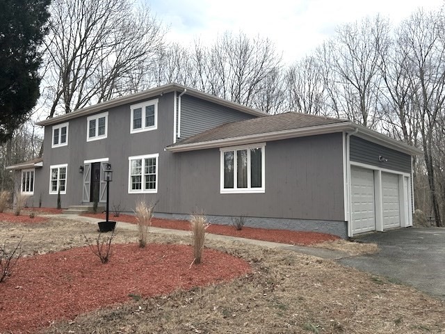 a house with trees in the background