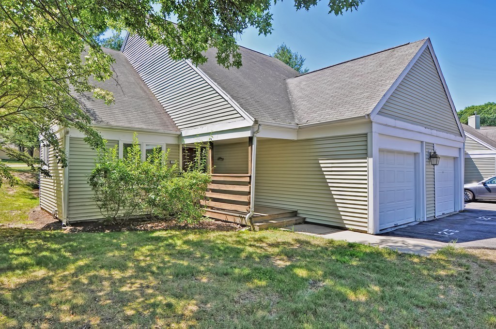 125 Stone Ridge Road, Unit 125 Franklin, MA 02038 - Photo 1 of 24 a view of a house with a yard