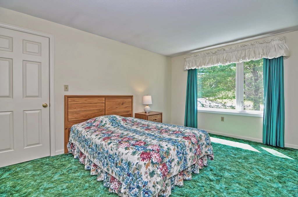 125 Stone Ridge Road, Unit 125 Franklin, MA 02038 - Photo 15 of 24 a bedroom with a bed and a window