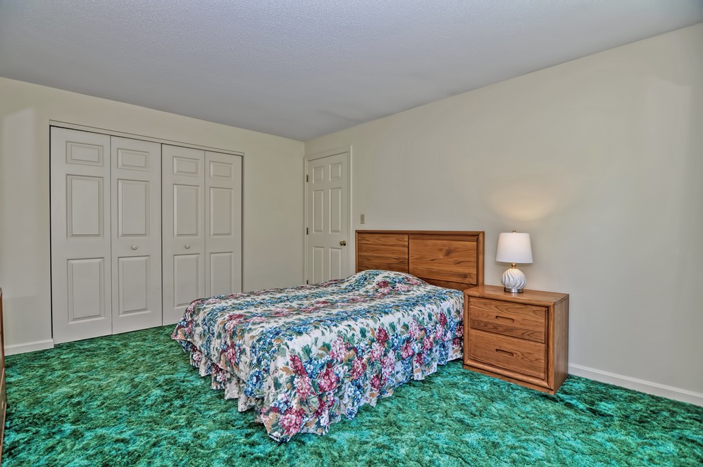 125 Stone Ridge Road, Unit 125 Franklin, MA 02038 - Photo 16 of 24 a bedroom with a bed and a dresser