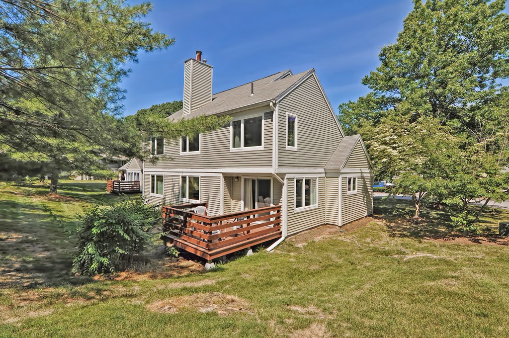 125 Stone Ridge Road, Unit 125 Franklin, MA 02038 - Photo 21 of 24 a view of house with a yard and deck