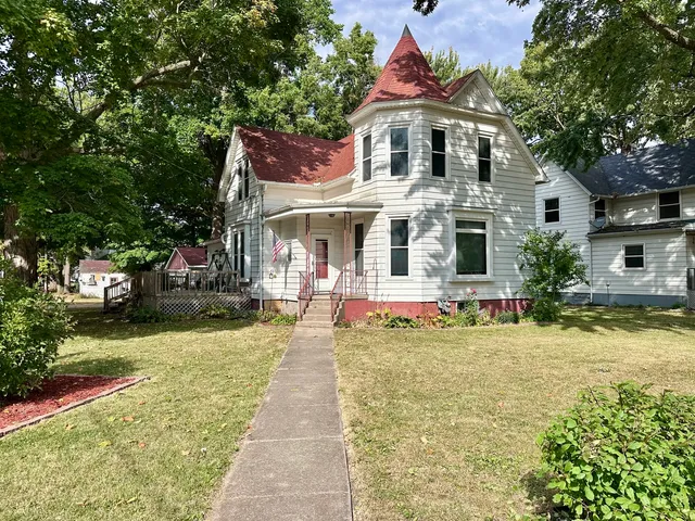 a front view of a house with swimming pool
