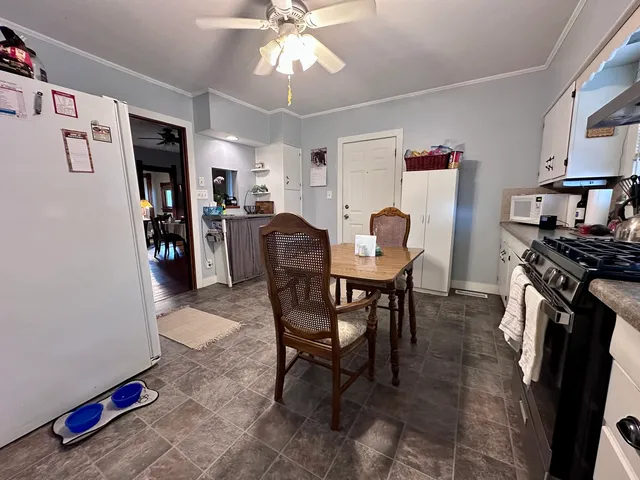 a dining room with furniture and window