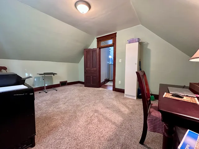 a view of a storage & utility room with clothes and shoes